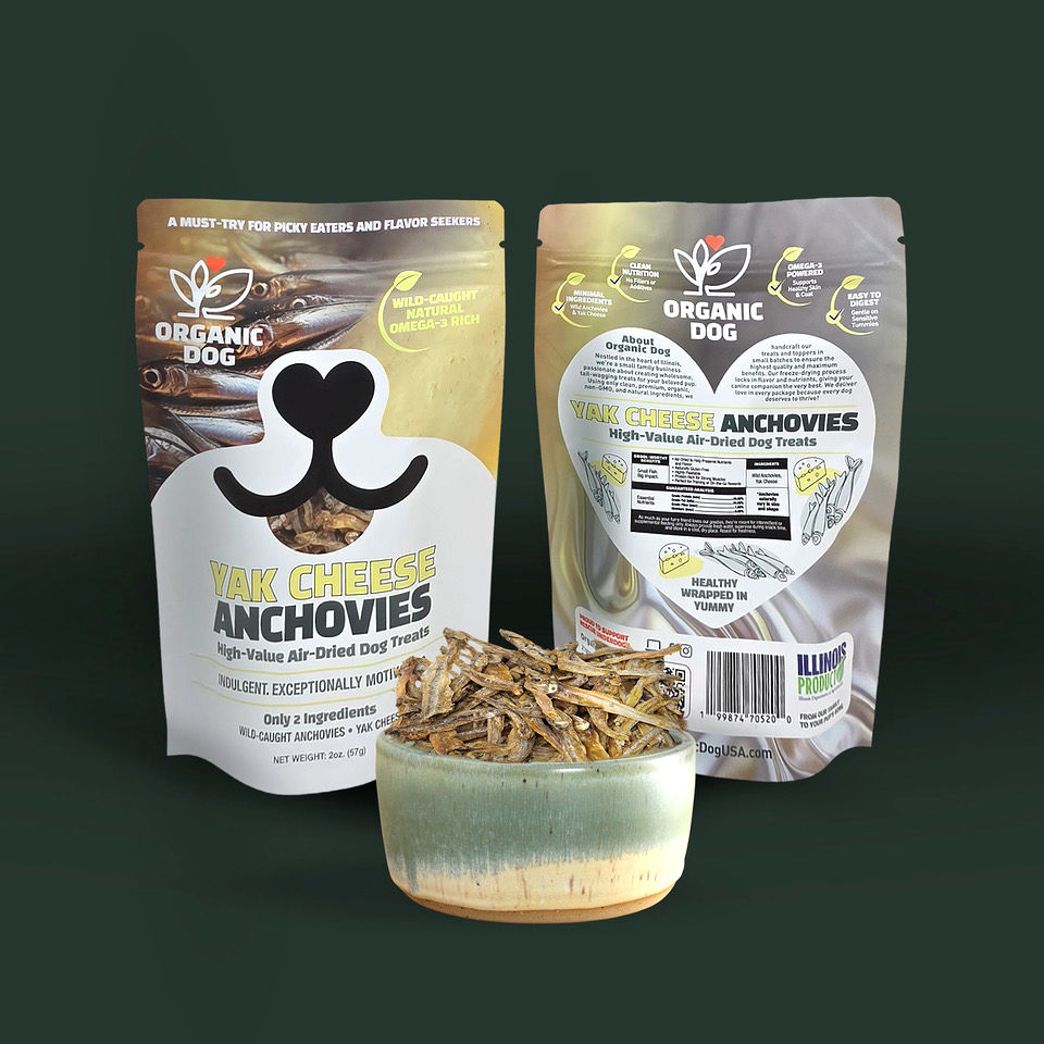 Organic Dog Yak Cheese Anchovies front and back bags beside a bowl of air-dried anchovy dog treats