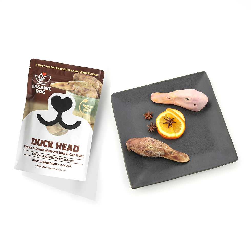 Thumbnail: Organic Dog freeze-dried duck head treat bag beside duck heads displayed on a black tray