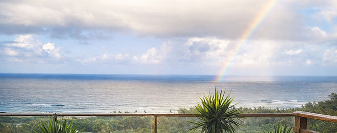 Serene spa view with rainbow over ocean_edited.jpg