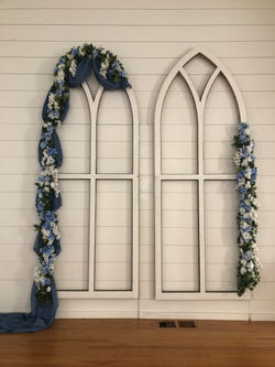 Trinity Chapel Arbor with Blue Arrangement.jpeg