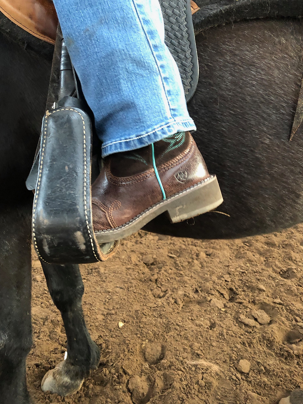 This is a dangerous way to ride. When you ride on your toes, instead of your heels, you increase your chance of falling forward onto or over your horse's neck.