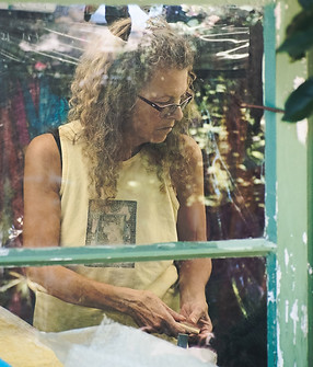 Master felting artist through old window.jpg