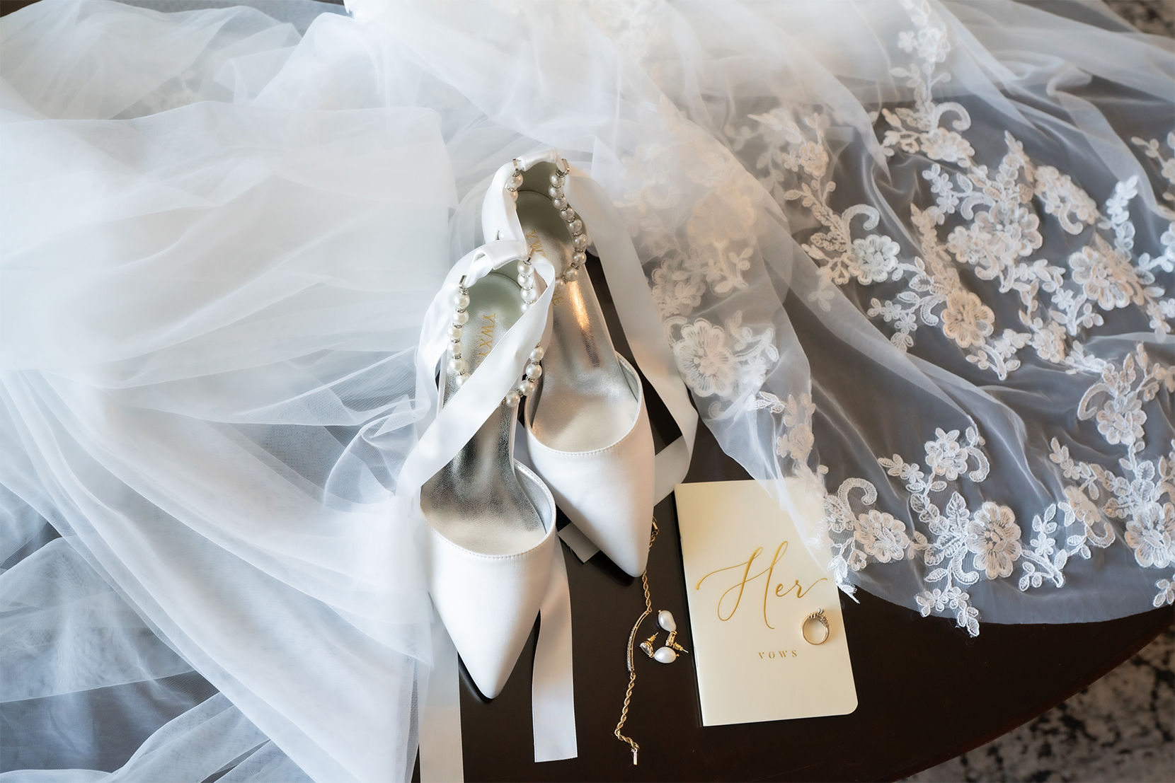 just-married-bride-holding-the-bouquet-and-showing-her-wedding-ring