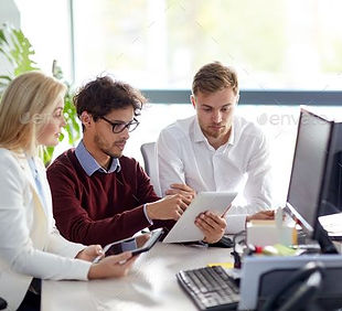 business team with tablet pc at office.jpg