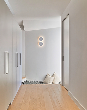 Light-Filled Hallway with timber flooring, showcasing precision and clarity of sanus build's residential construction