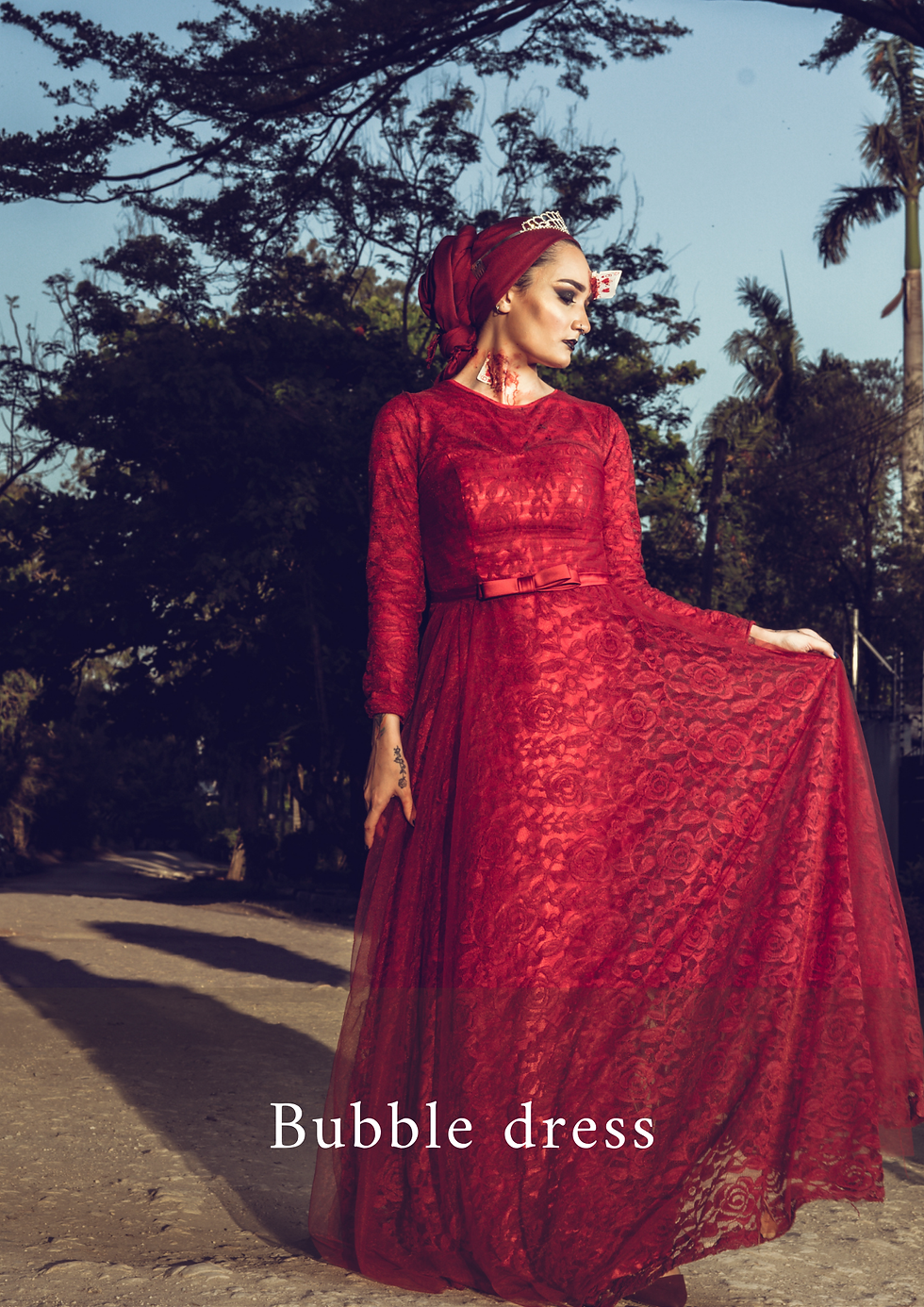 A lady wearing a lace dress