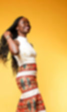 A lady wearing a long Ankara skirt