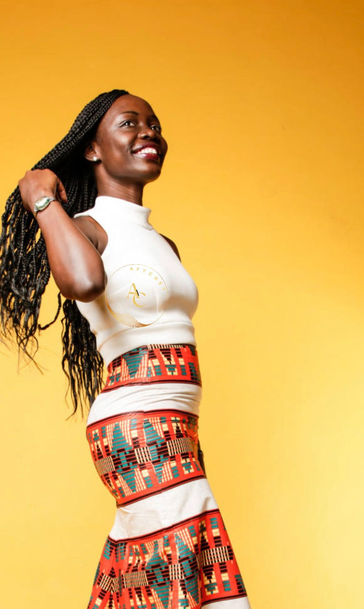 A lady wearing a long Ankara skirt