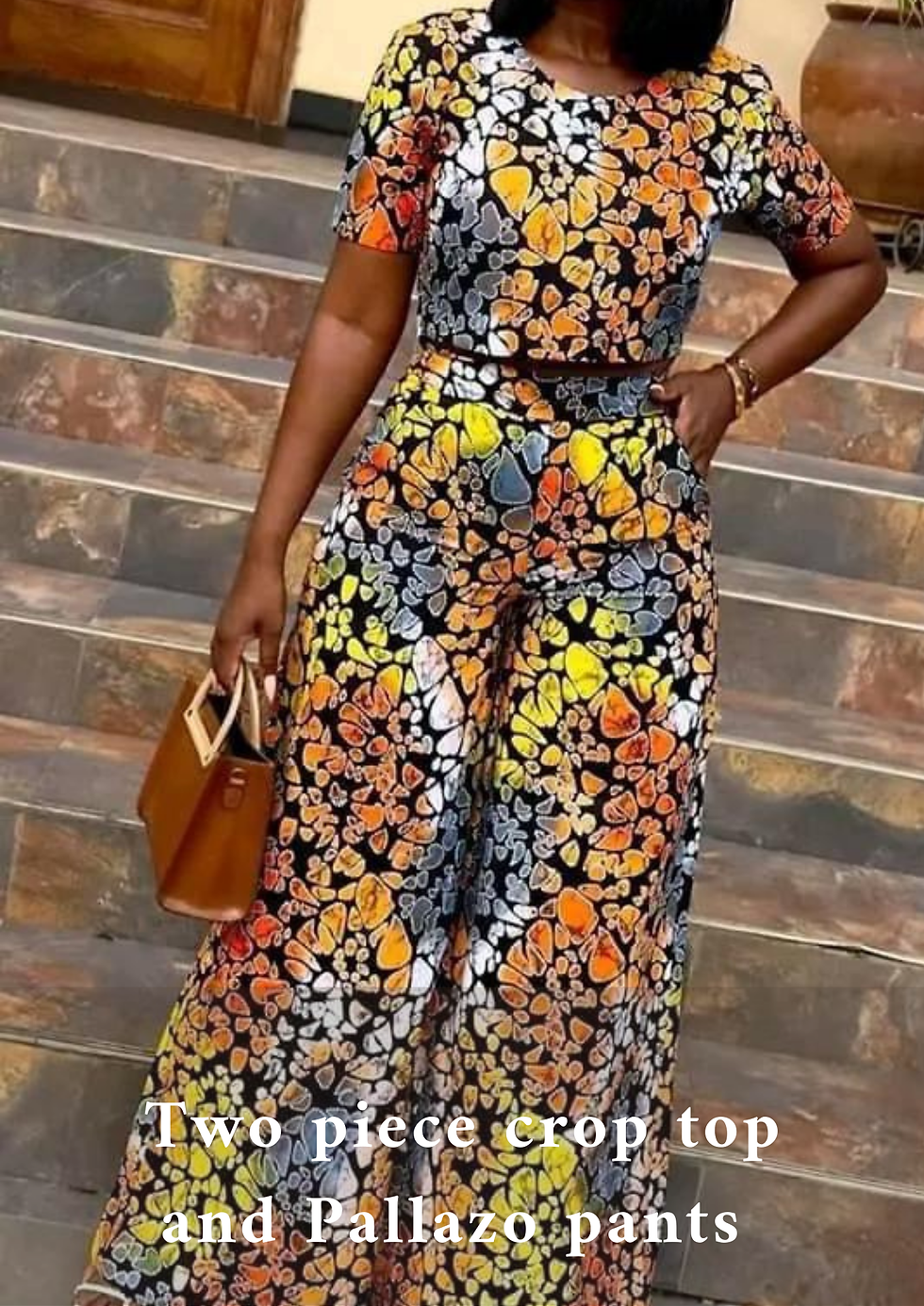 A lady wearing a two-piece top and palazzo pants