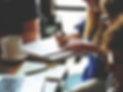 group of people at a table working together