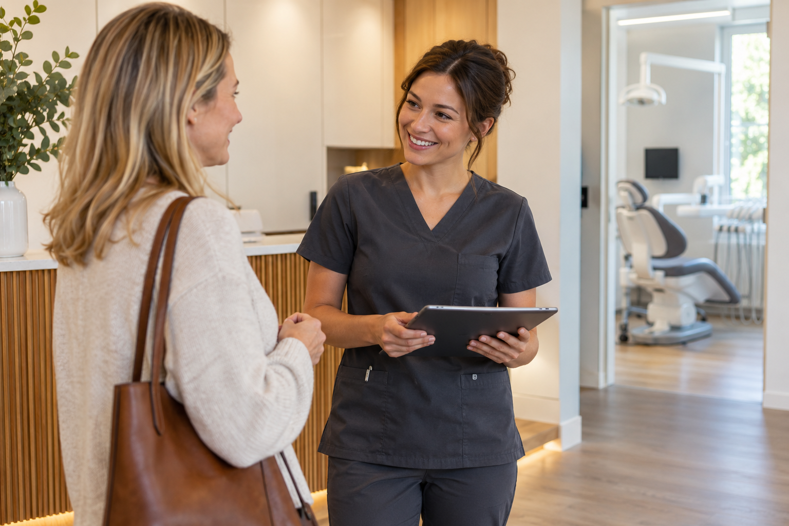 Dental professional welcoming a patient at a clinic