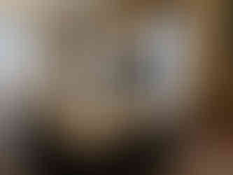 One last cleaning, two staff members making sure the window is perfectly clean before it goes in