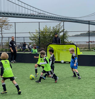 Kids playing soccer in Shore Road Park.