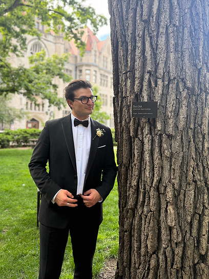 Mathew Goryl, founder of Bur Oak Building Co., standing beside a bur oak tree in Chicago.