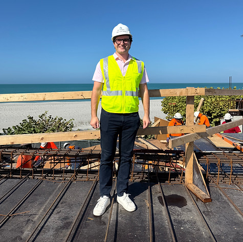 Mathew Goryl, founder of Bur Oak Building Co., standing on a custom coastal home construction site.