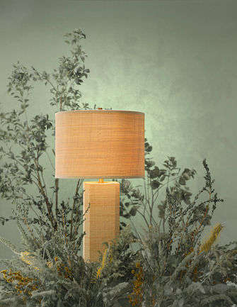 Decorative table lamp photographed in a botanical setting
