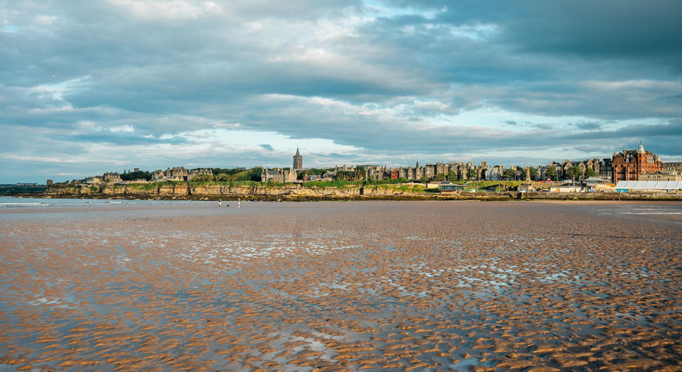 Panoramic view across the coastline of St Andrews at low tide.