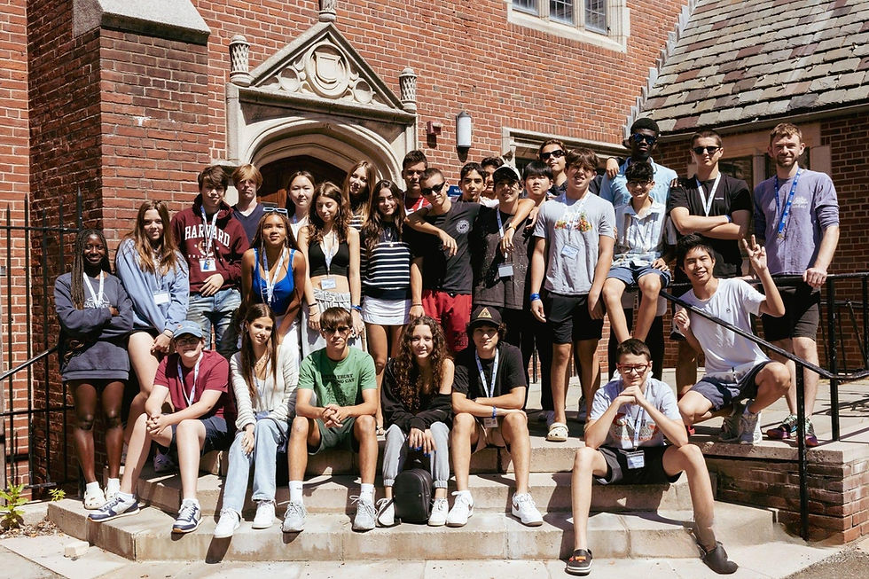 Group of ISSOS students smiling and posing together outside a historic building at Yale.