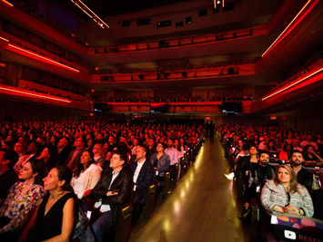 The audience at YouTube’s Brandcast 2023 watches intently.