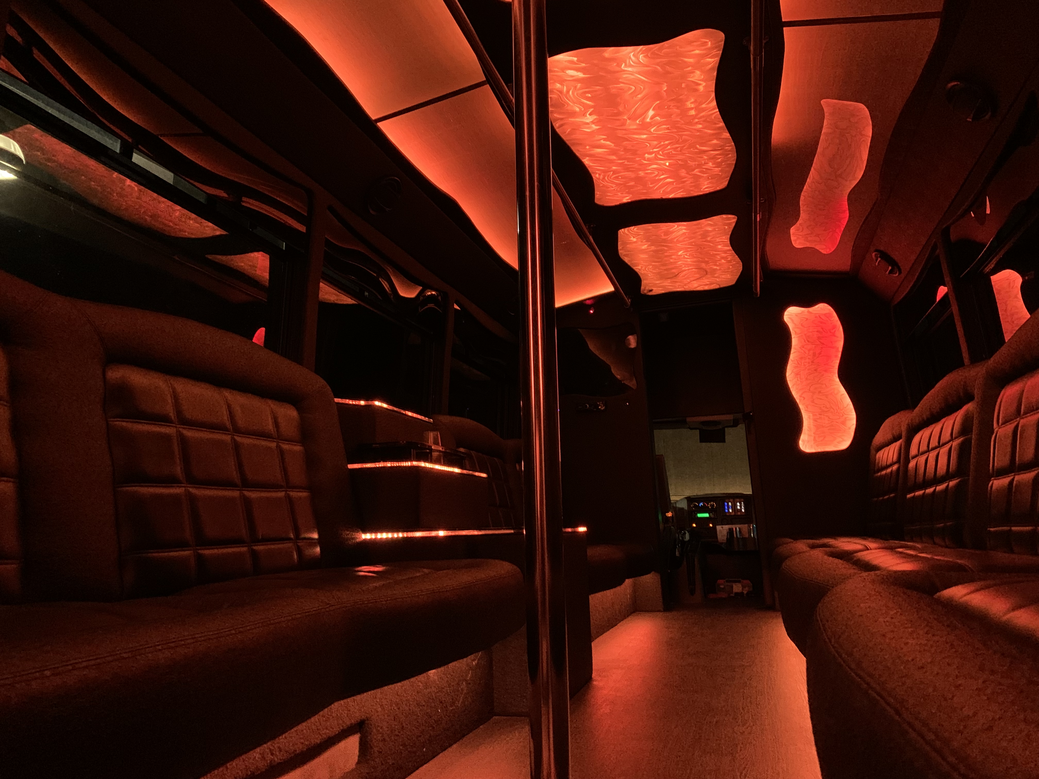 CharlotteLUX Party Bus Interior in Red LED Lighting