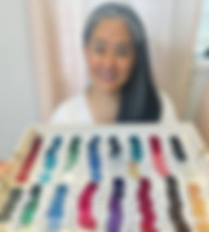 A client holding her finished color palette during her color analysis.