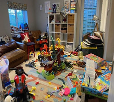 Toys and clutter in living room.