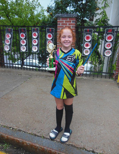 A picture of Monica, a little girl of 11 years old who won the local peashooting contest held in Berlin NH