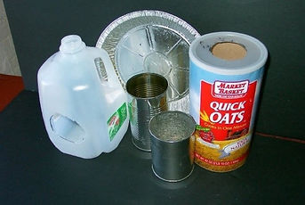 A picture of fun targets you can make for Comet Peashooters from everyday home items such as an alluminum pie pan and an empty milk jug - www.cometpeashooters.wix.com