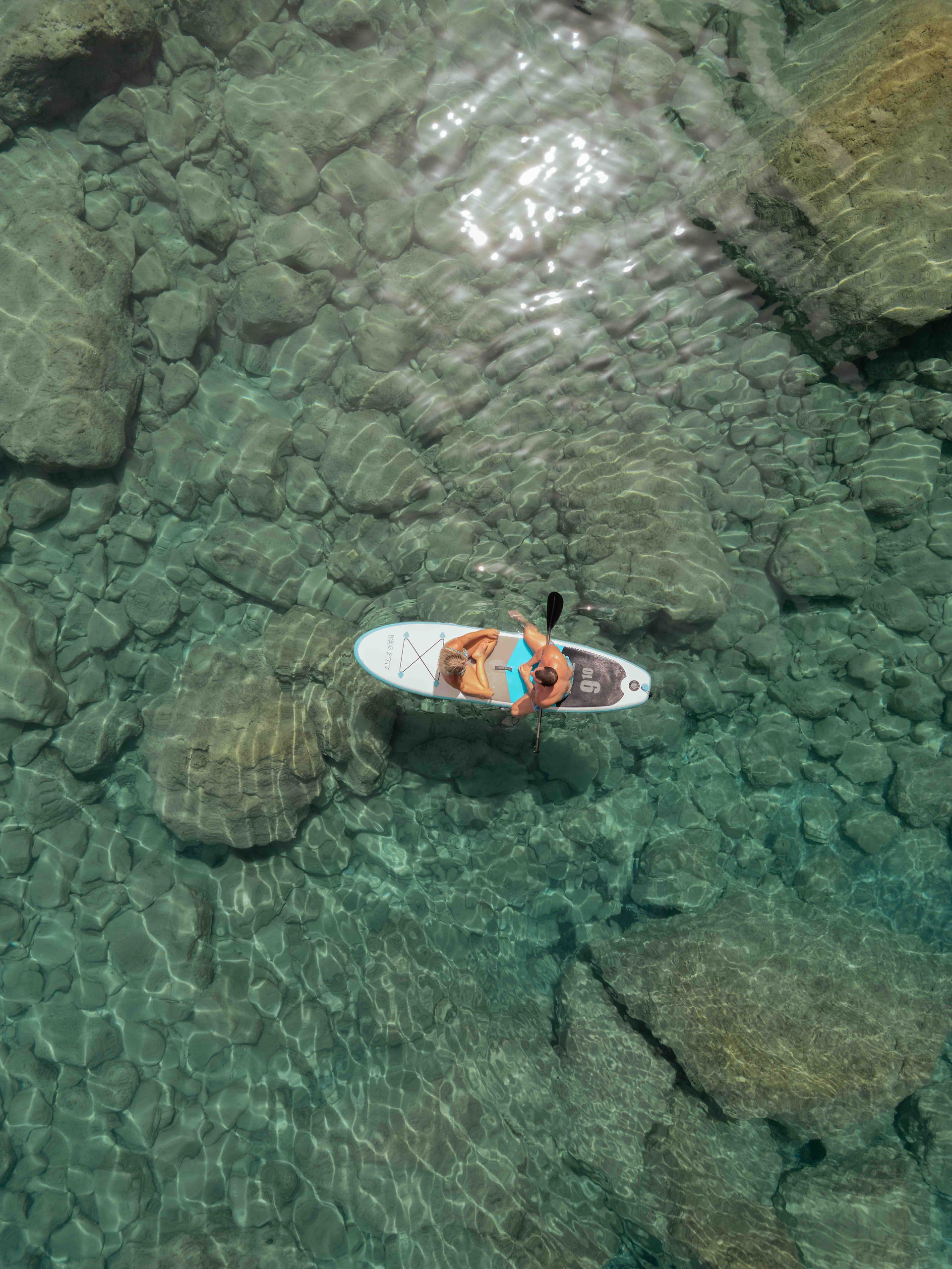 Greece Elopement Photography paddle at cave