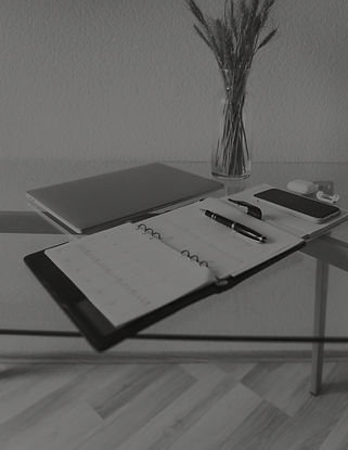 Desk with laptop and agenda