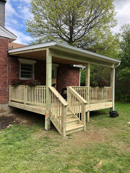 Newly constructed deck with stairs by Ryan Davis Contracting