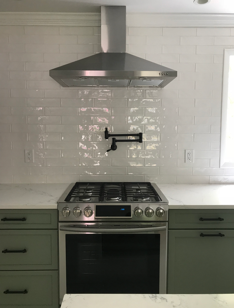 Modern kitchen remodel with range and hood