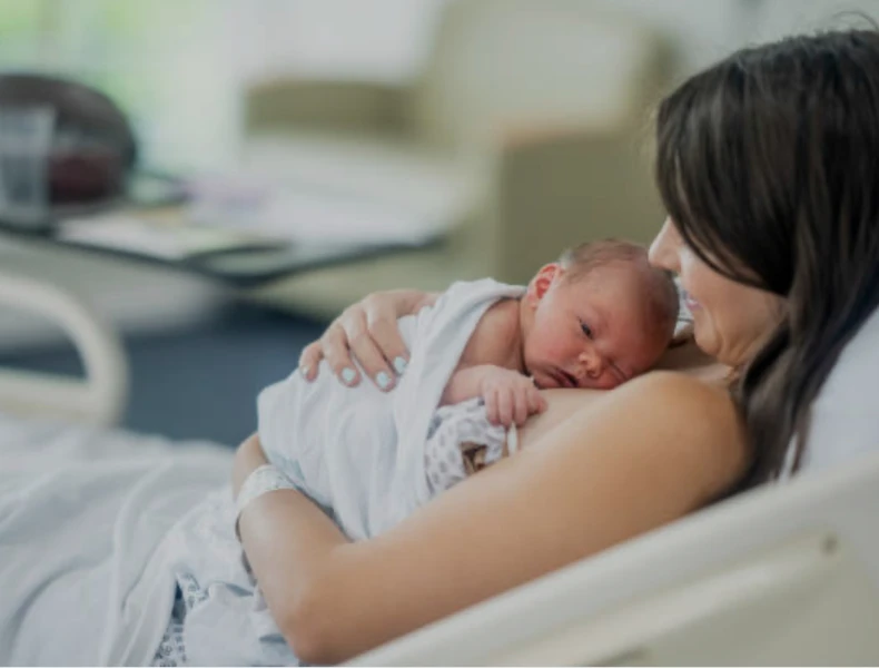 Mom doing skin to skin with baby right after birth