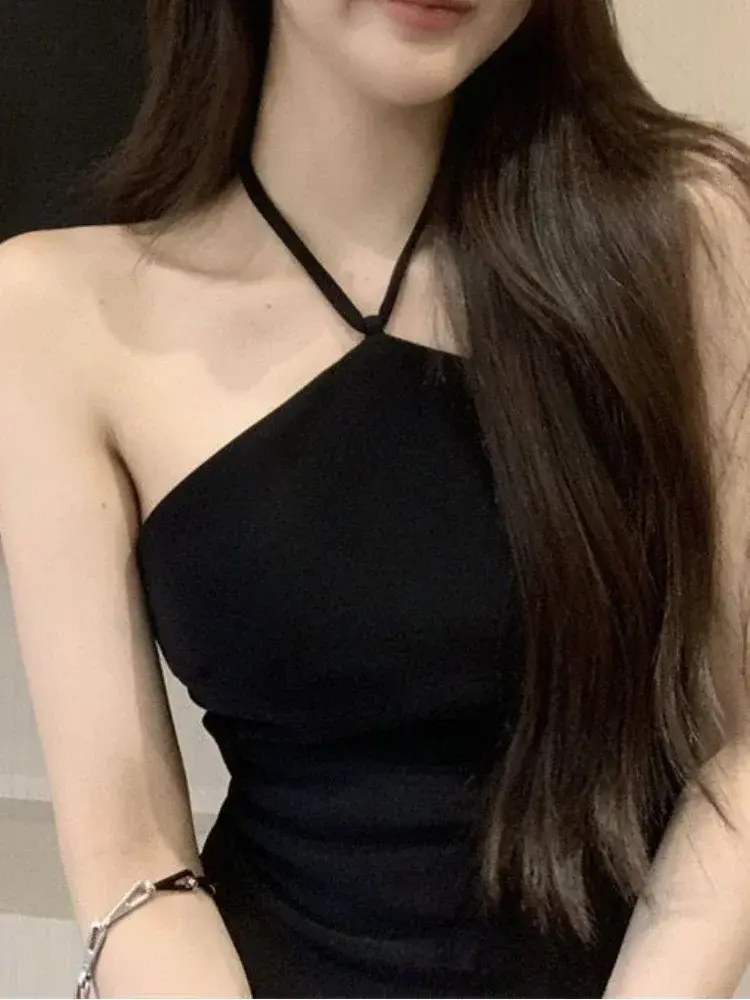 The Miley Cyrus Black Backless Mini Dress, featuring a backless design and mini length. Available at Cusuti.