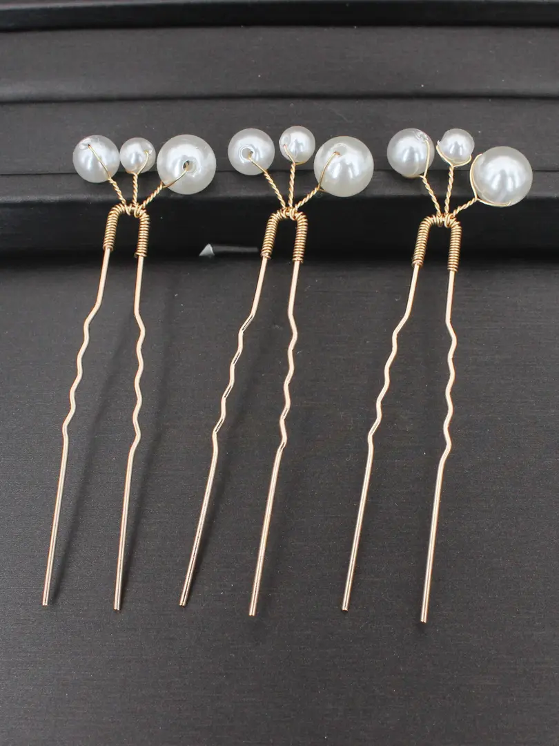 Pair of silver metal hair sticks with a round design Inspired by Cusuti's signature effortless style.