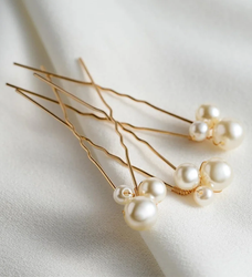 Pair of silver metal hair sticks with a round design Inspired by Cusuti's signature effortless style.