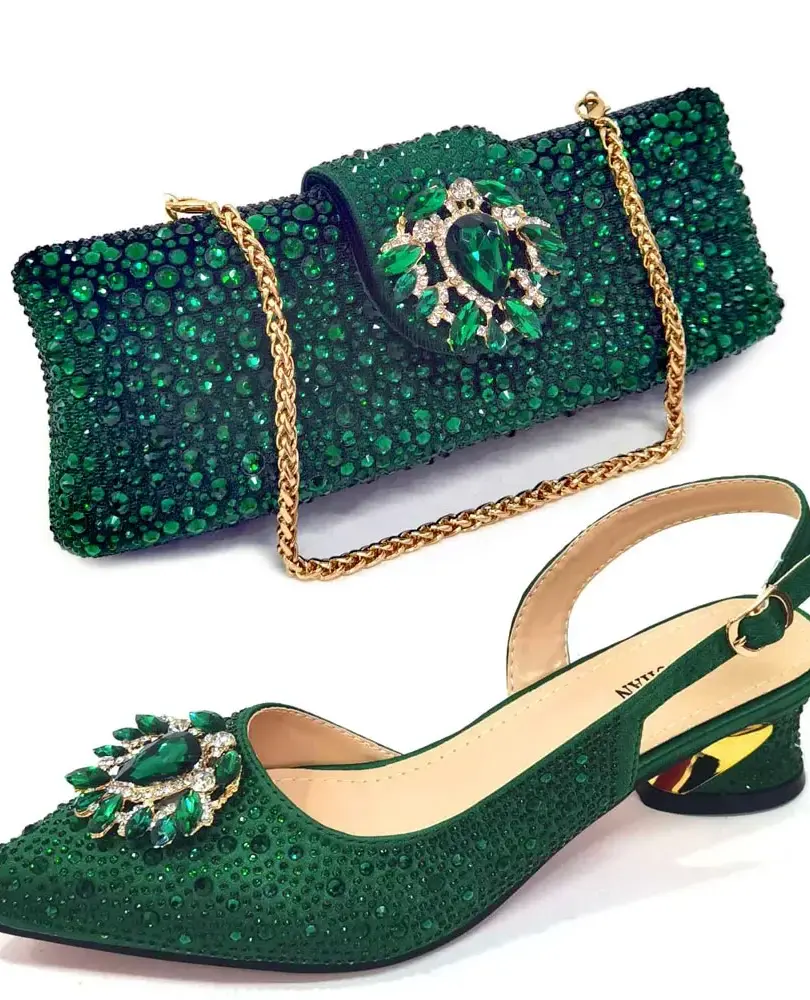 Sparkling slingback pumps with 4.3CM spike heels and buckle strap closure. Matching clutch bag with metal handle.