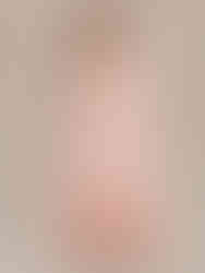 A photo of a model wearing a A-line evening dress made from flowing chiffon with a v-neckline, regular sleeves,