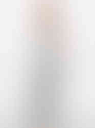 A woman wearing a Cusuti two-piece set featuring a relaxed-fit hooded top with a front pocket and flowy maxi-length, wide-leg