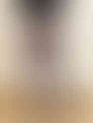 A photo of a woman wearing black Cusuti jogger pants with a relaxed fit and tapered leg.