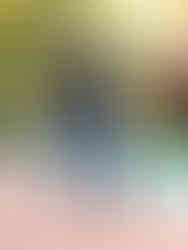 Pair of dark navy skinny jeans with slight fading details, showcasing the form-fitting silhouette.