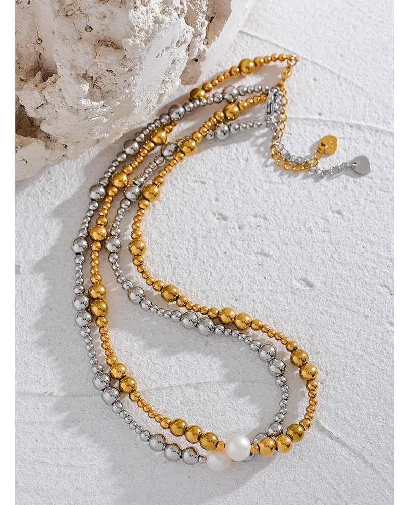 Features a trendy geometric design with a gleaming gold-plated finish, centered with a single, elegant freshwater pearl.