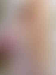 Photo of model wearing a strapless A-line evening dress by Cusuti . The dress is made of polyester tulle and lace appliques.