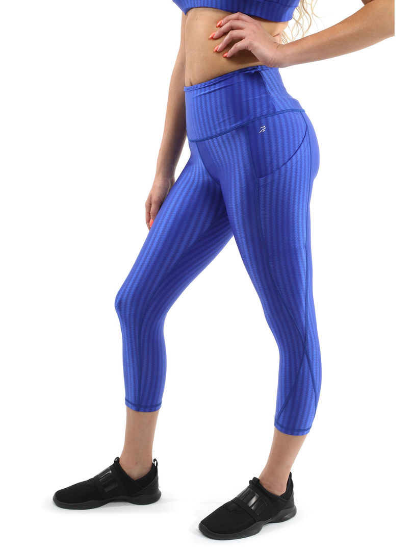 Blue high-waisted leggings and matching sports bra from a workout set by Cusuti.