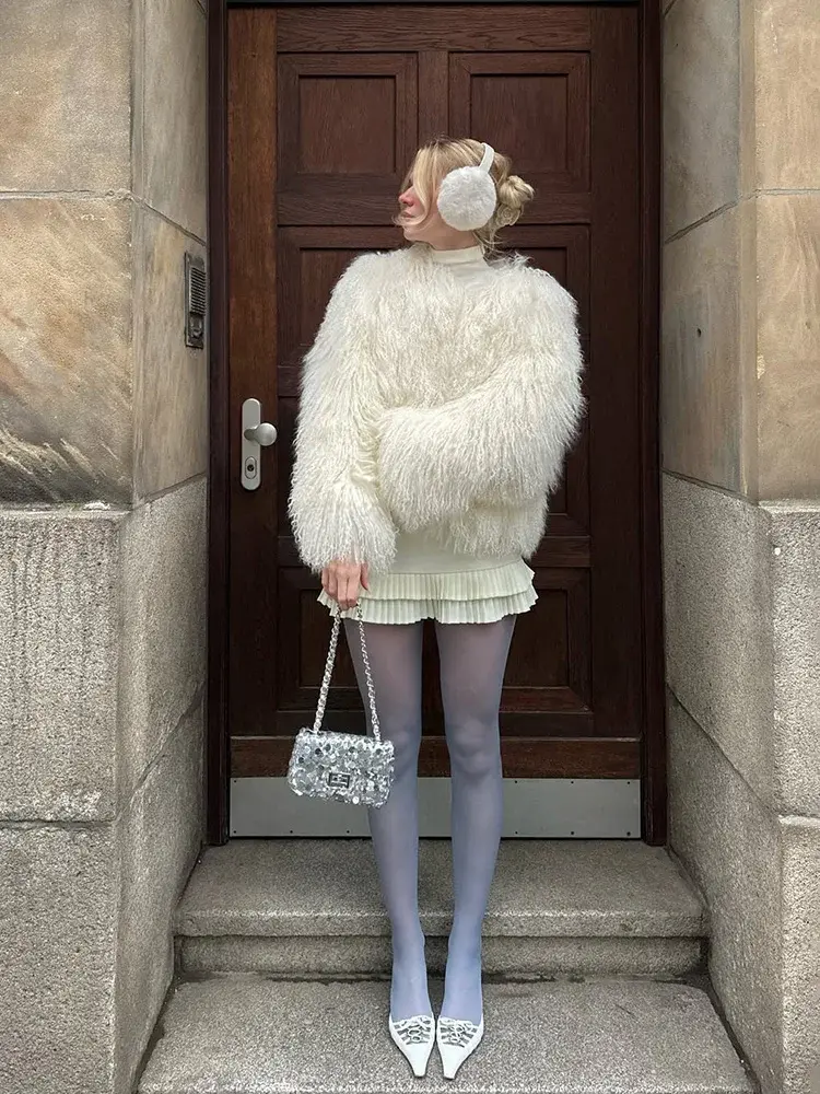 The Miley Cyrus Inspired Faux Fur Jacket, featuring a plush, oversized teddy faux fur design. Available at Cusuti.