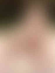 A photo of a woman wearing Cusuti coffee python print leggings with a high waist.