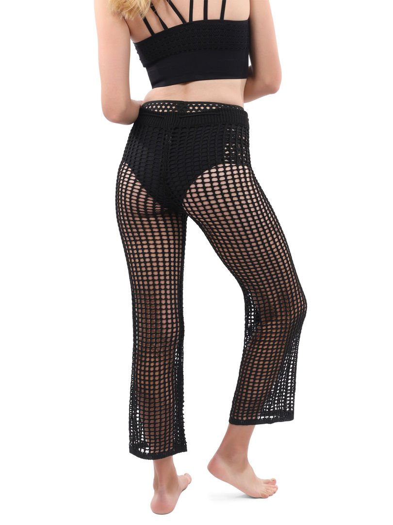 Crochet beach pants with mesh see-through fabric, mid-rise drawstring waist closure, made from a comfortable cotton blend. Cu