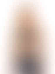 A woman wearing black&white high-waisted compression leggings with a black&white sports bra, working out. Cusuti