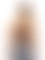 A woman wearing black&white high-waisted compression leggings with a black&white sports bra, working out. Cusuti