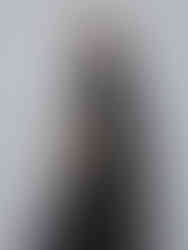 Two t-shirts (black and green) with crewneck collars and short sleeves. Relaxed fit.